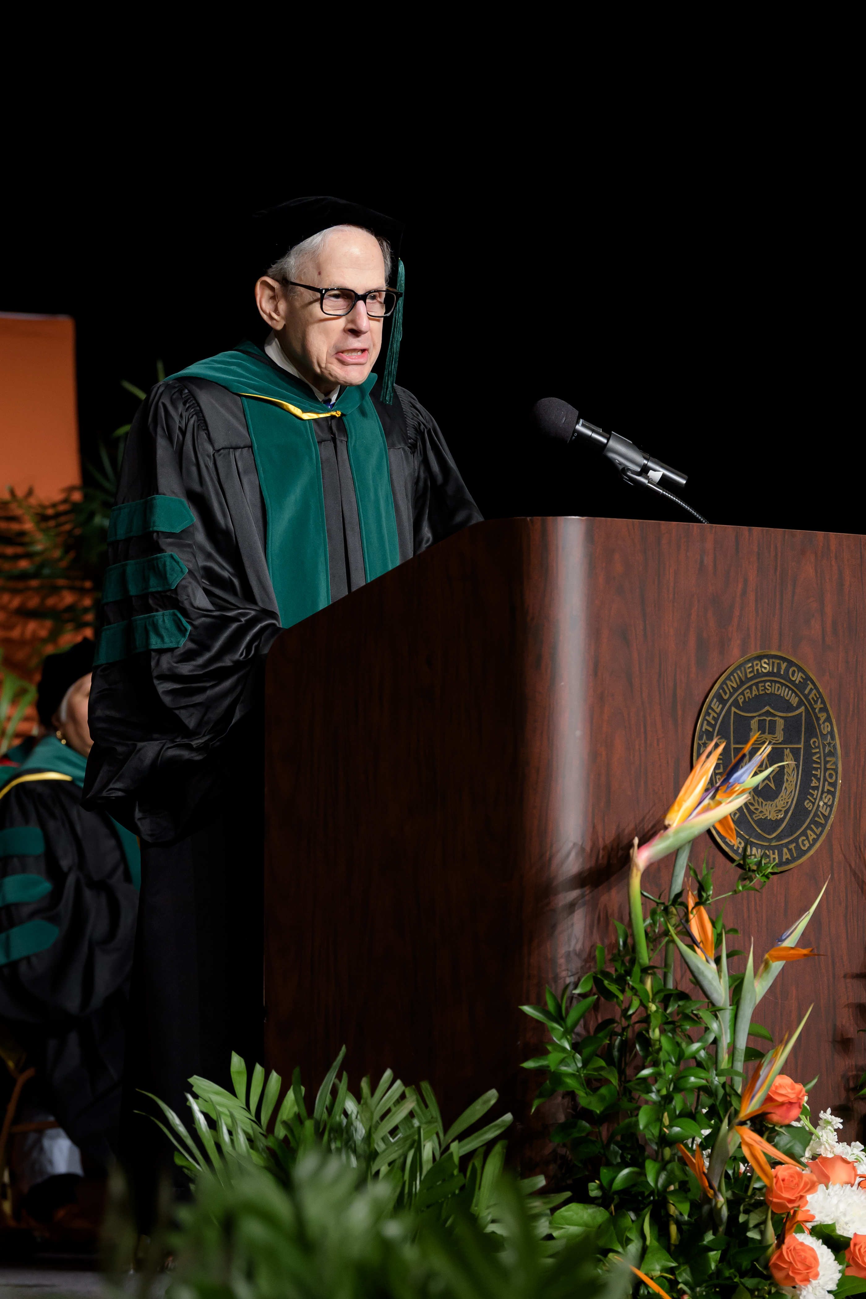 Dr. Coller Dr. Coller delivering a speech at the 2026 JSSOM MD Commencement